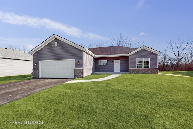 ranch-style house featuring a garage and a front lawn