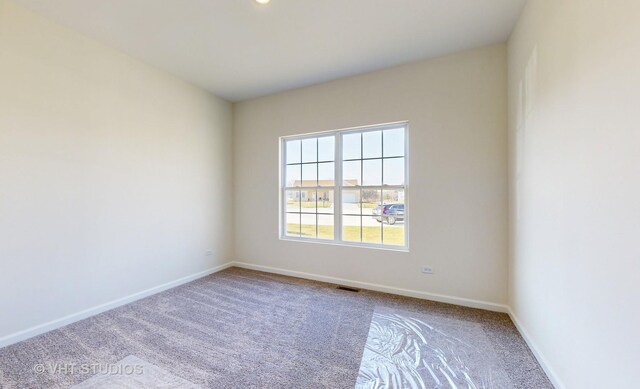 view of carpeted spare room