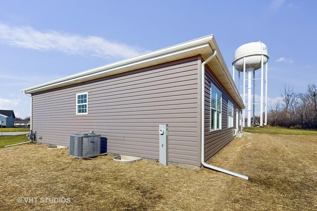 view of property exterior featuring central air condition unit