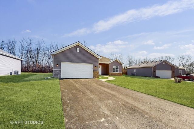 ranch-style home featuring a garage and a front yard