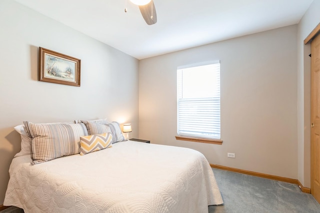 carpeted bedroom featuring ceiling fan and baseboards