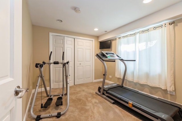 exercise room with light carpet, baseboards, and recessed lighting