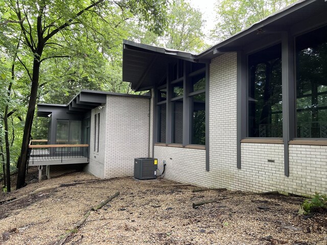 view of home's exterior with central AC