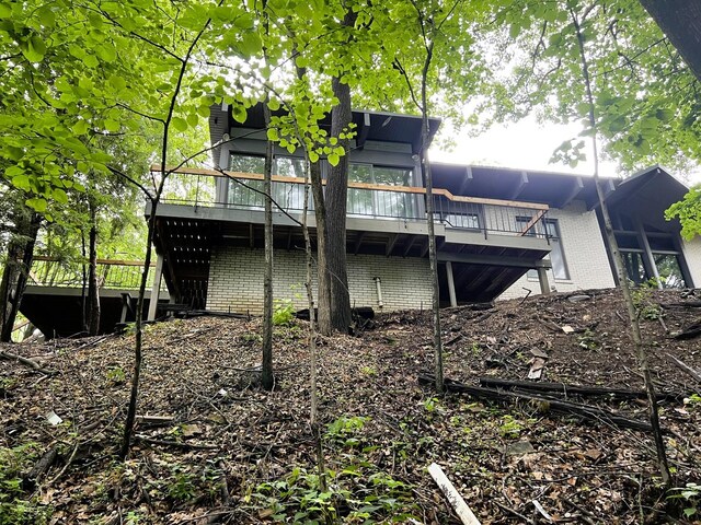 rear view of property with a deck