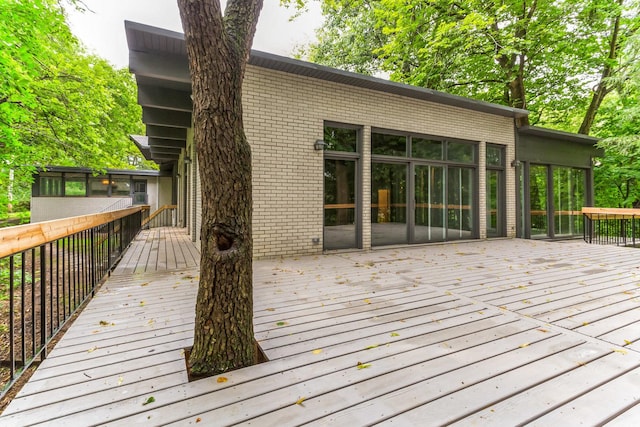 deck with a sunroom