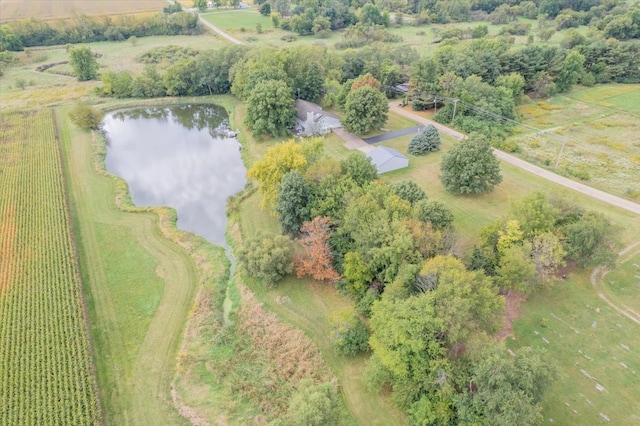 birds eye view of property with a rural view and a water view