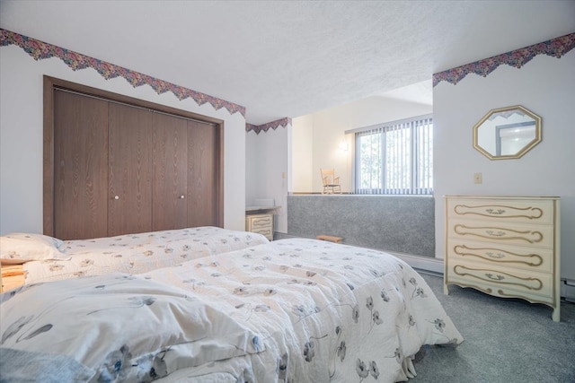 bedroom with a closet and carpet flooring