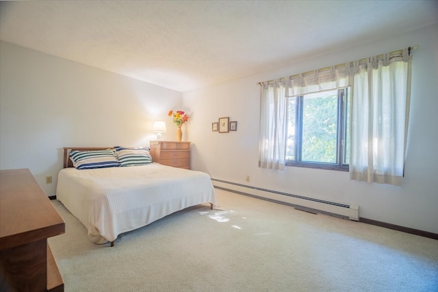 carpeted bedroom with baseboard heating