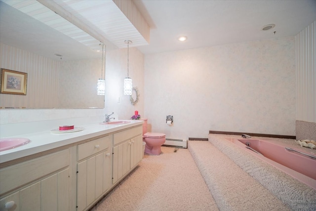 bathroom with a washtub, vanity, toilet, and a baseboard radiator