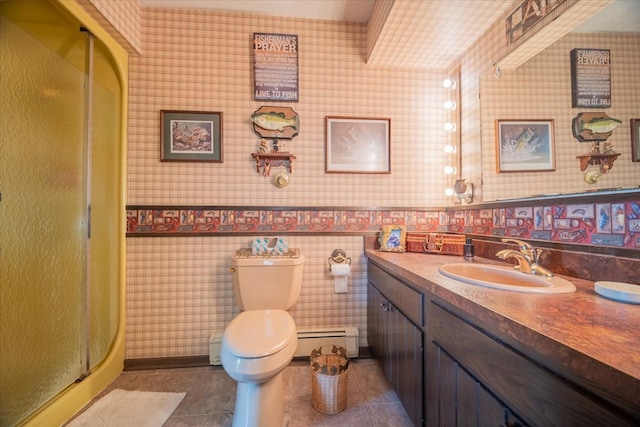 bathroom featuring vanity, toilet, baseboard heating, walk in shower, and tile patterned flooring