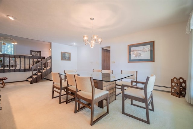 carpeted dining area with a notable chandelier and baseboard heating