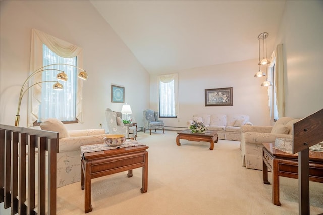 carpeted living room with baseboard heating, plenty of natural light, and high vaulted ceiling