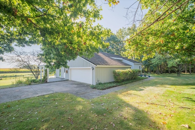 view of property exterior featuring a lawn