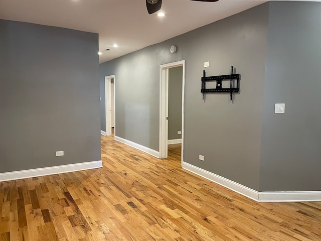 empty room featuring light hardwood / wood-style floors and ceiling fan