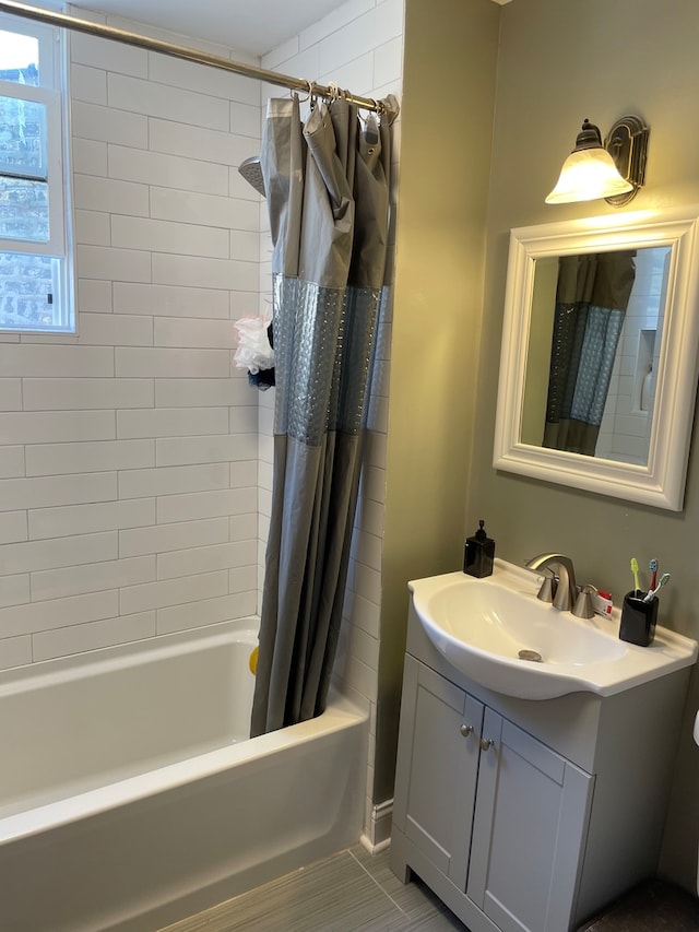 bathroom featuring vanity, shower / bath combination with curtain, and tile patterned flooring