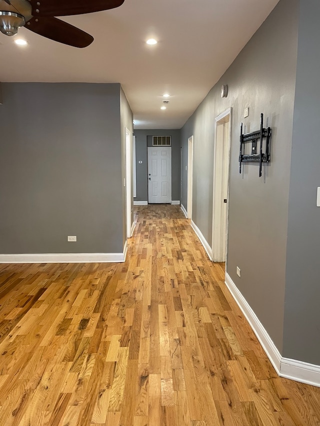 hall with light hardwood / wood-style floors