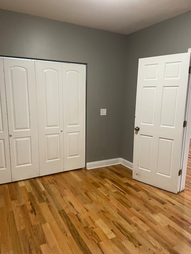 unfurnished bedroom featuring light hardwood / wood-style floors