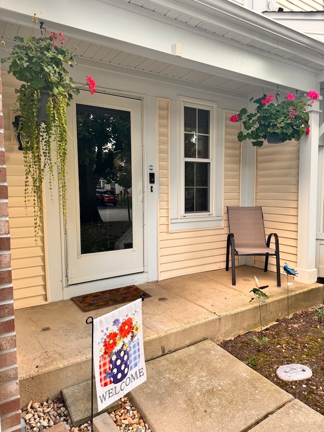 property entrance featuring covered porch