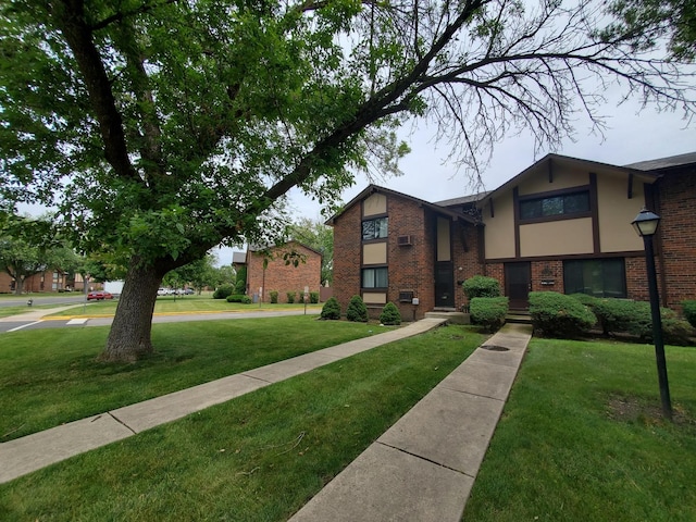 view of home's community with a yard