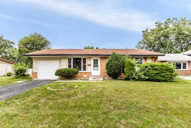 single story home featuring a garage and a front yard