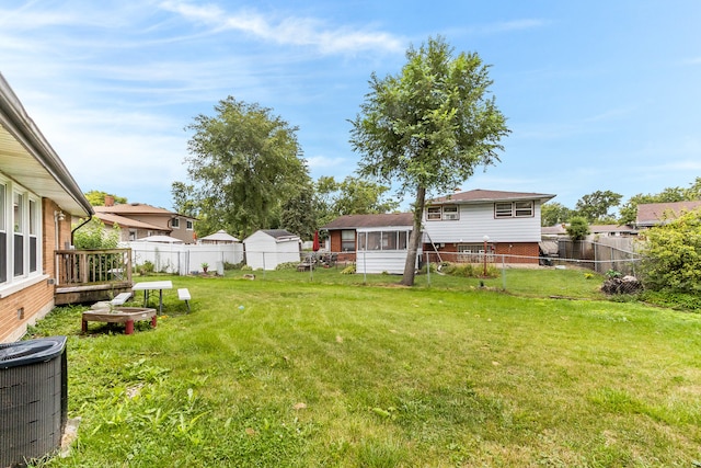 view of yard featuring central air condition unit