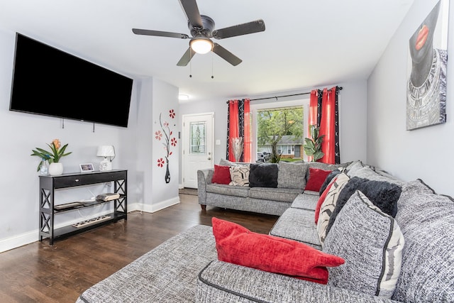 living room with dark hardwood / wood-style floors and ceiling fan