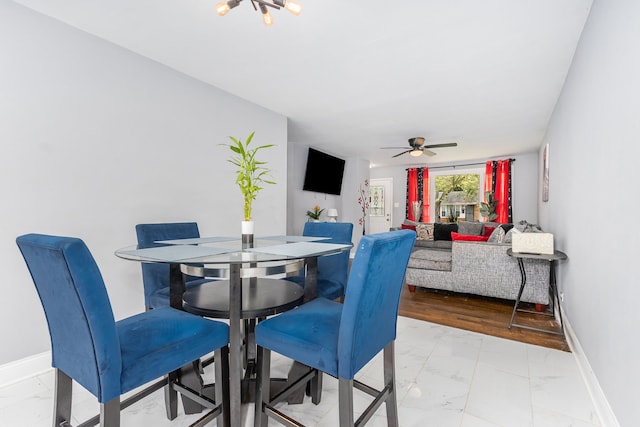 dining space featuring light hardwood / wood-style flooring and ceiling fan