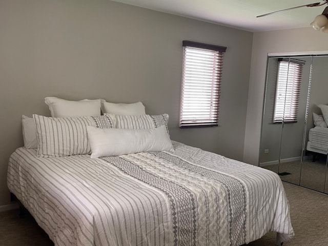 carpeted bedroom featuring ceiling fan