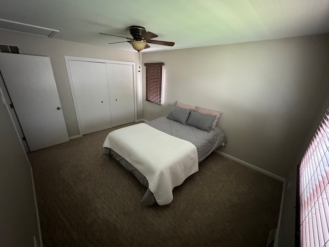 carpeted bedroom featuring ceiling fan and a closet