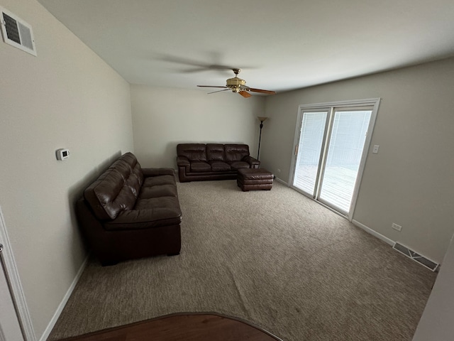 living room featuring ceiling fan and carpet flooring