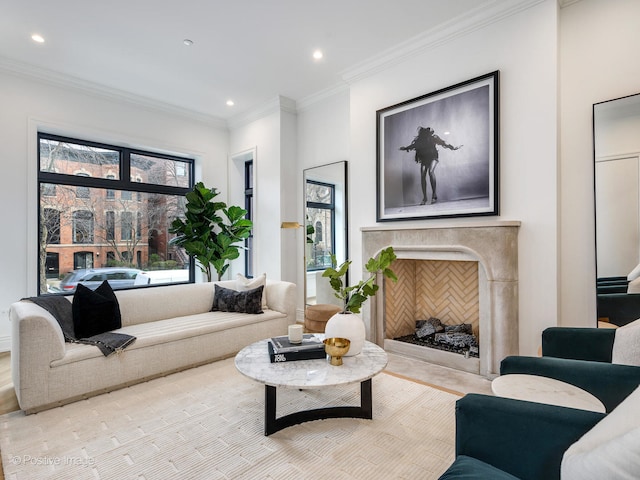 living room featuring a high end fireplace and ornamental molding