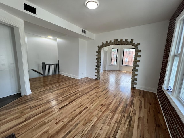 spare room with hardwood / wood-style floors