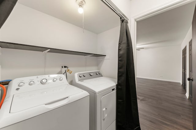 laundry room featuring dark wood-style floors, laundry area, baseboards, and washer and dryer