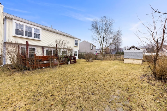 view of yard with a fenced backyard and an outdoor structure