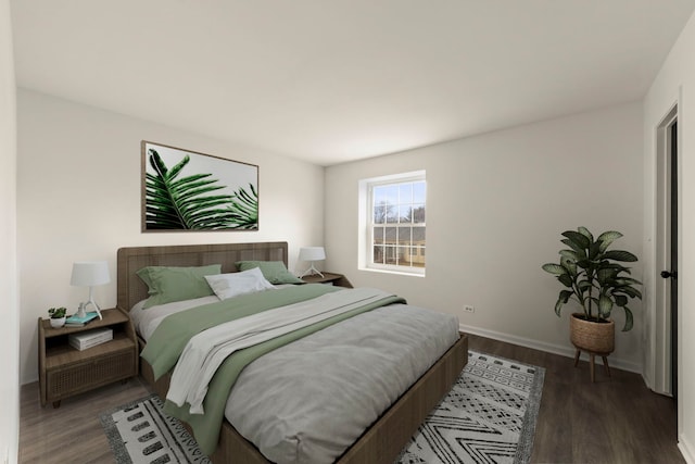 bedroom featuring baseboards and wood finished floors