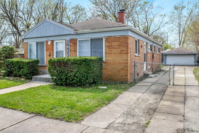 bungalow-style home with a front yard