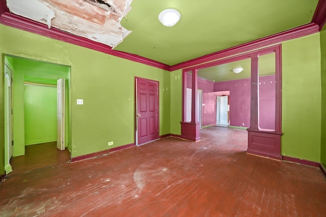 interior space featuring decorative columns and dark hardwood / wood-style flooring