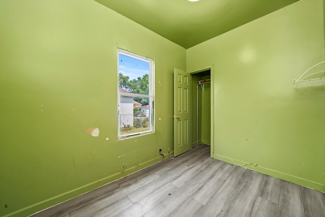 unfurnished bedroom with light hardwood / wood-style floors