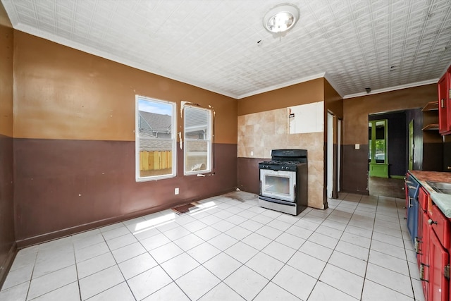 kitchen featuring range with gas cooktop and light tile patterned floors