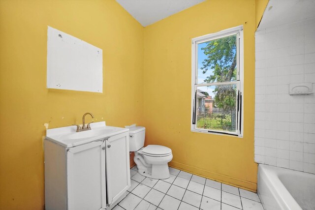 full bathroom with plenty of natural light, vanity, tile patterned floors, and toilet