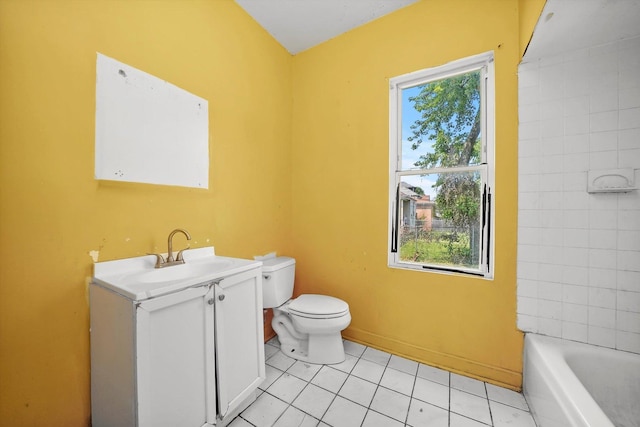 bathroom with vanity, toilet, tile patterned flooring, and a washtub