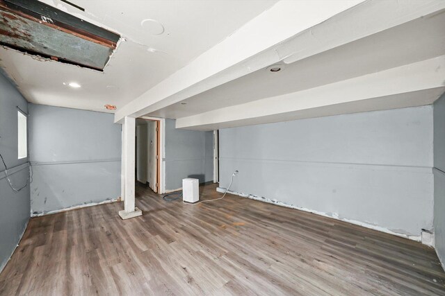 basement featuring hardwood / wood-style flooring