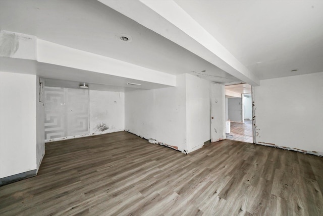 basement with hardwood / wood-style floors