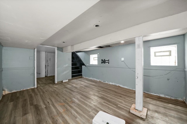 basement with hardwood / wood-style flooring