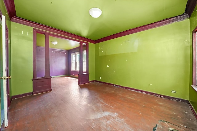 unfurnished room with wood-type flooring and ornamental molding