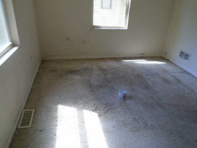 empty room featuring light colored carpet