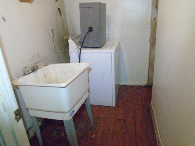 laundry area featuring washer / clothes dryer and dark wood-type flooring