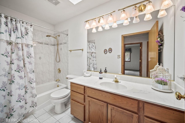 full bathroom with visible vents, toilet, shower / bath combo, vanity, and tile patterned flooring