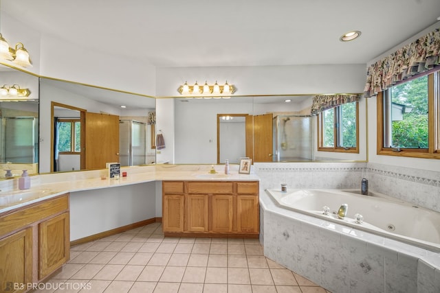 bathroom featuring independent shower and bath, vanity, and tile patterned flooring