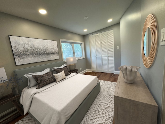 bedroom featuring wood-type flooring and a closet